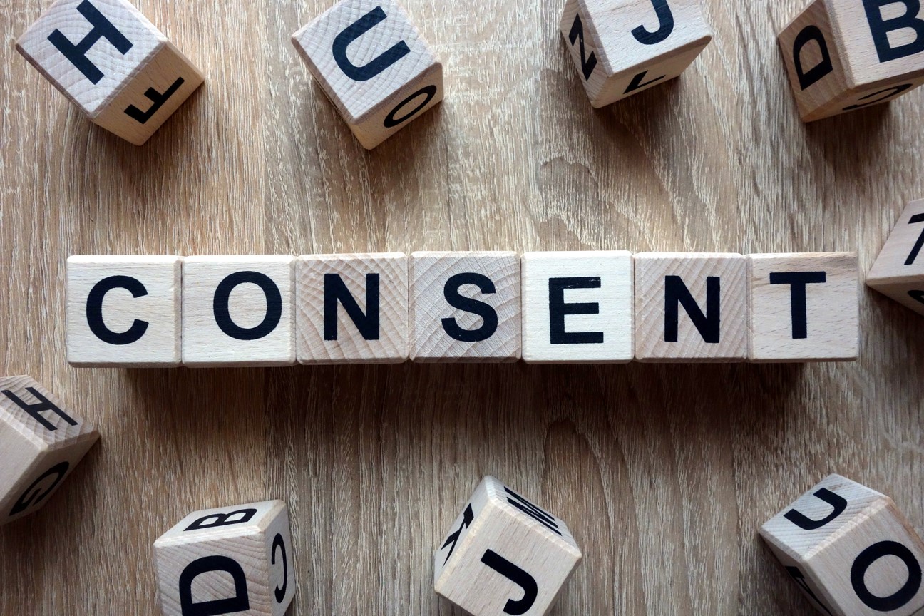 Photo of wooden letter tiles spelling "Consent"