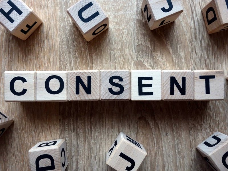 Photo of wooden letter tiles spelling "Consent"