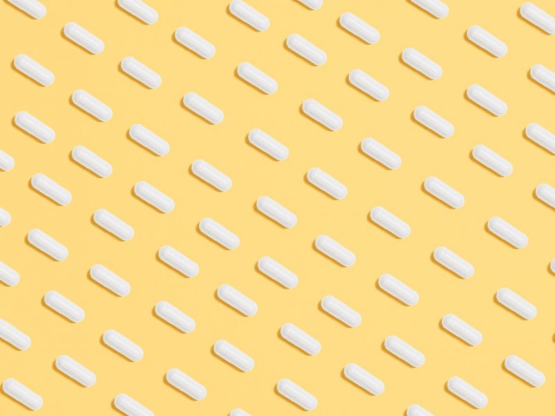 Photo of pills on a yellow background